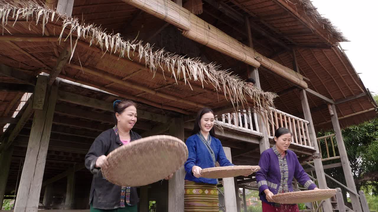 Women Threshing Rice in Traditional Village