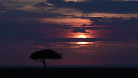 sunset behind the clouds at masai mara within the maasai mara national reserve in kenya