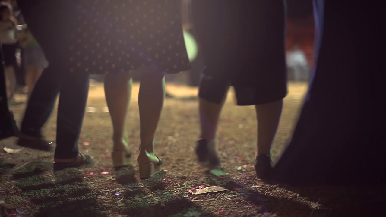Group of People Dancing at an Outdoor Night Event