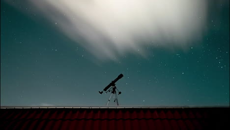 timelapse shot of my telescope on the roof of my house with the stars and clouds passing behind it.