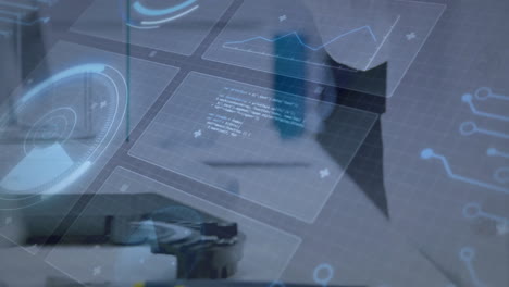 interacting with futuristic animation, hands displaying digital graphs and data