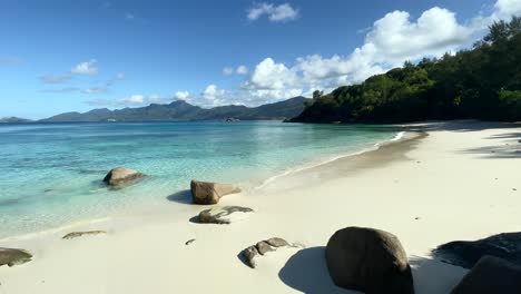 mahe seychelles beautiful white sandy beach, calm sea sunny day,and no people