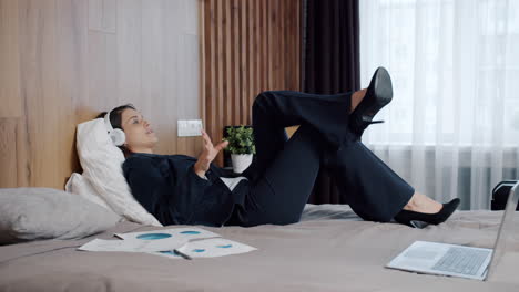 businesswoman relaxing in hotel room