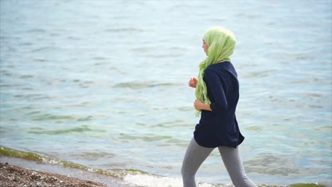 young woman running on the beach