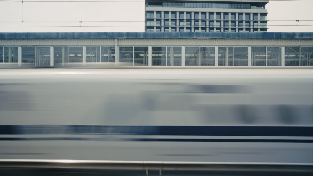 High-Speed Train Passing Through Station