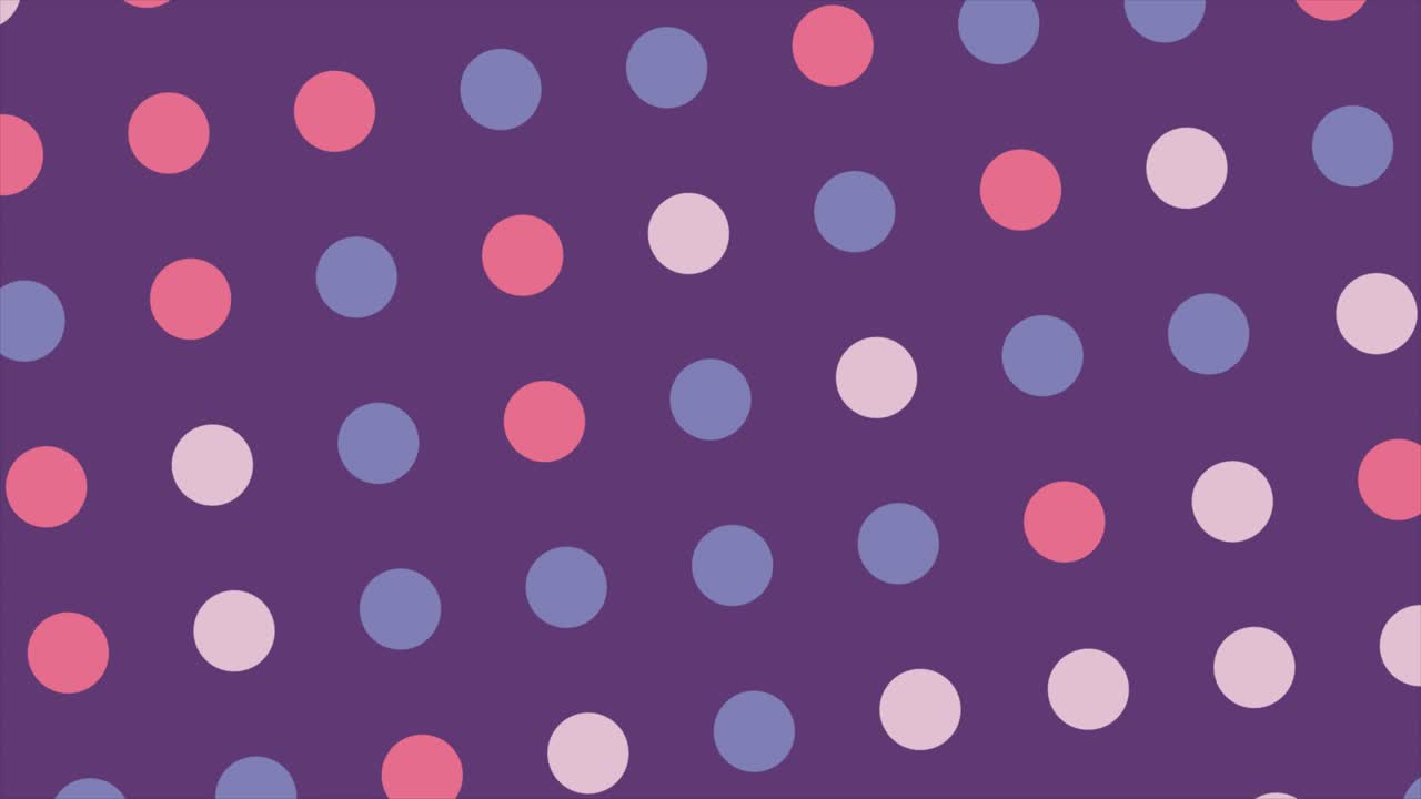 Animoitu pilkkukuvio laajenee purppuranvärisellä taustalla
