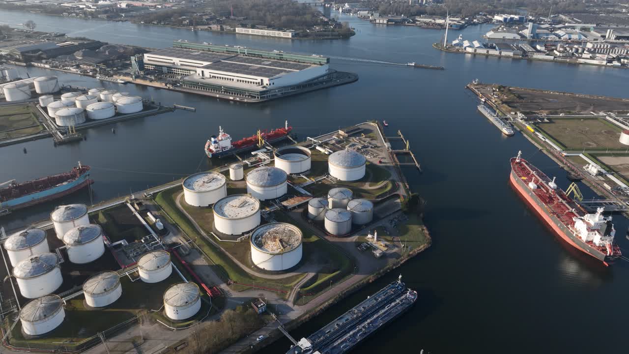 Petroleum port Amsterdam, shipping, petrol, energy, chemical transport over water. Industrial and transport. Aerial dorne video. The Netherlands.