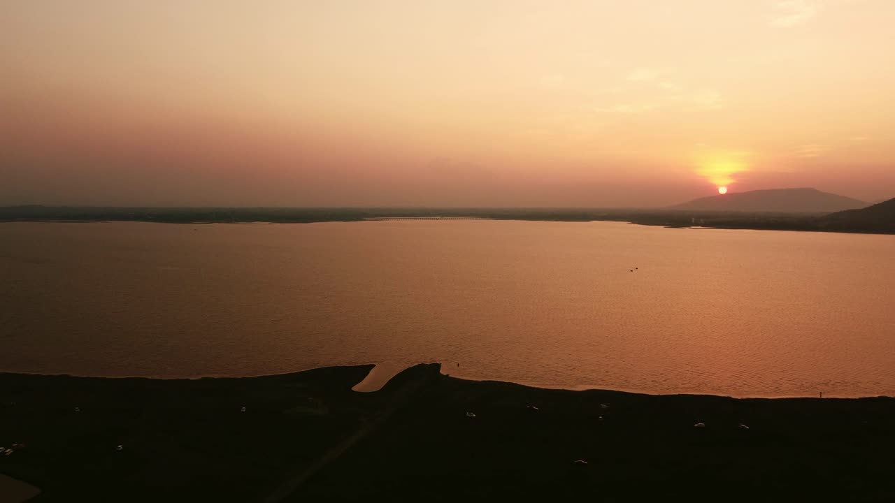 Majestic Mountains and Calm Waters Aerial Perspective of Nature's Beauty at Sunset
