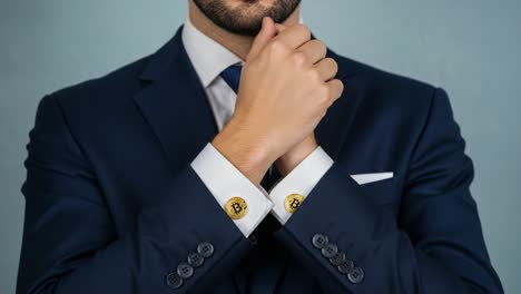 stylish man in a suit posing elegantly with cufflinks, exemplifying class and sophistication while showcasing attention to detail in fashion