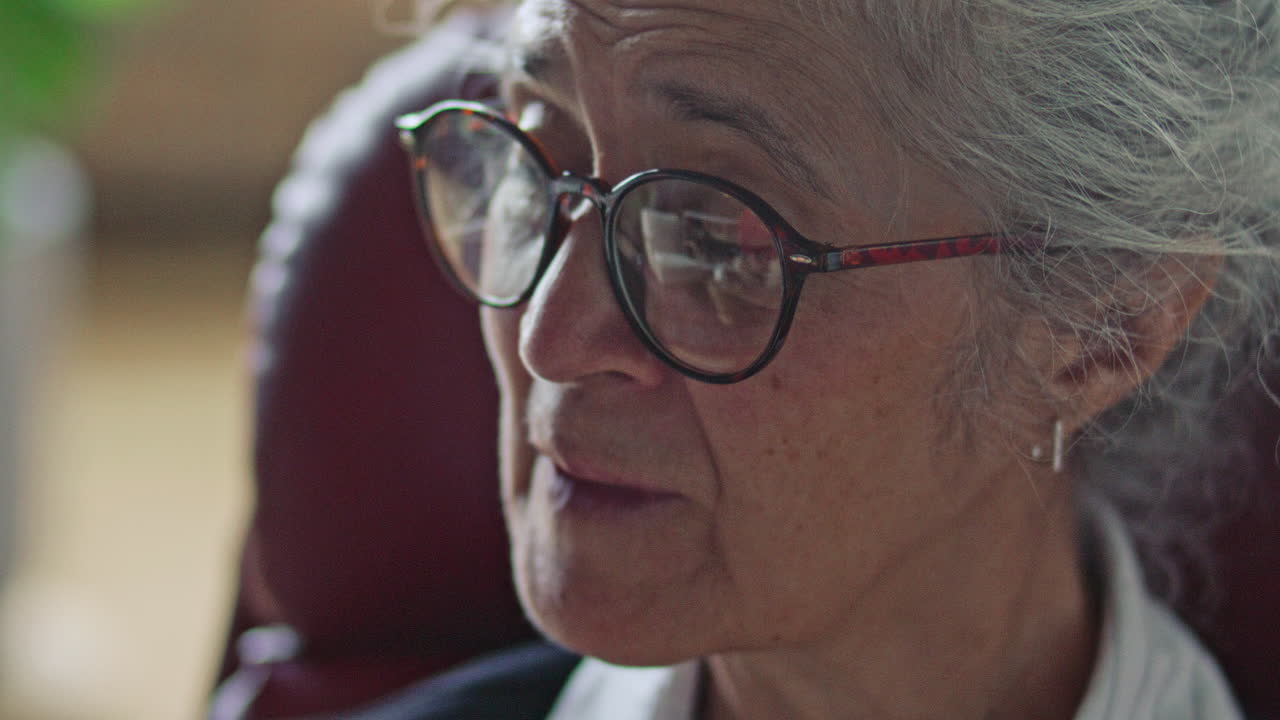 Elderly Female Therapist Speaking during Counseling Session with Patient