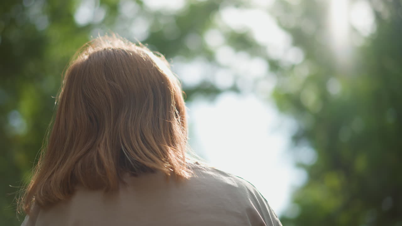 Serene Woman Amidst Vibrant Trees, Tranquil Woman Peacefully Immersed In Green Forest Scenery With Sunlight, Gentle Female Figure Quietly Contemplating Serene Beauty Of Sunlit Woodland Environment