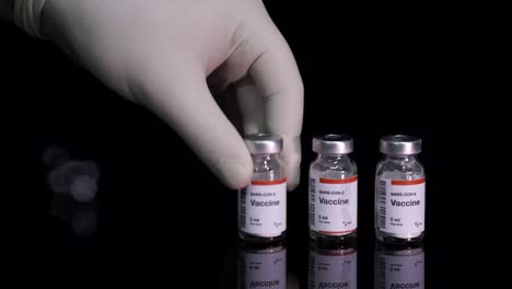 Vaccine-bottles-ready-for-injection-syringe-by-nurse,-prevention-from-Coronavirus