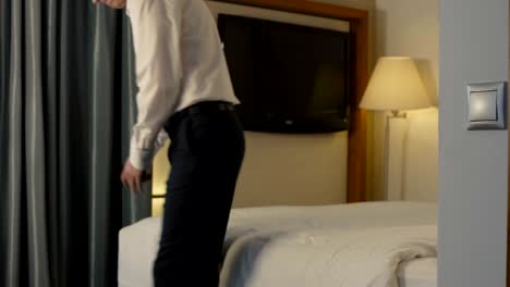 businessman checking in hotel room during trip