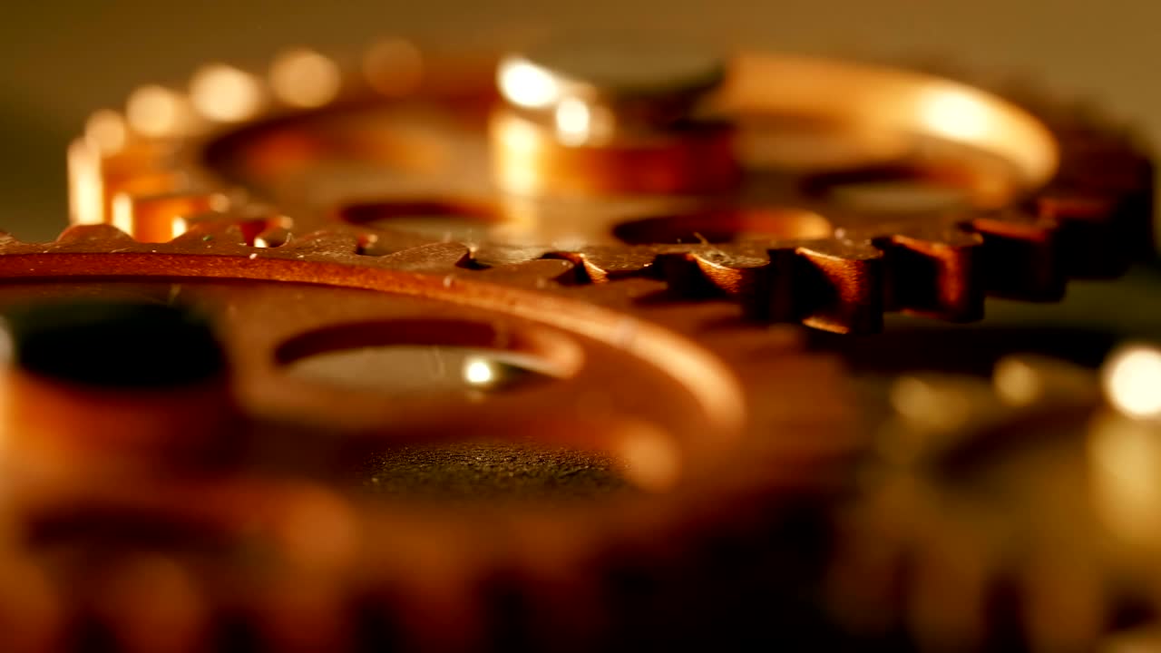 clock's mecahanical wheels rolling-close up