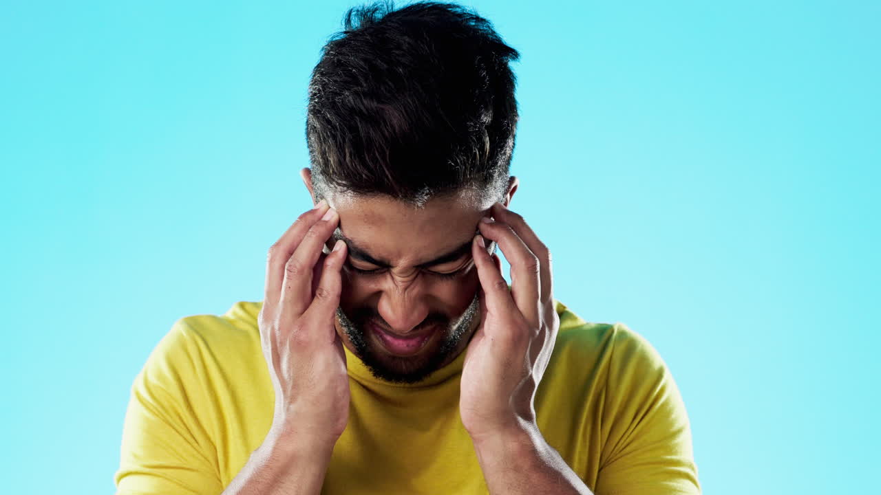Stress, headache and man athlete in a studio