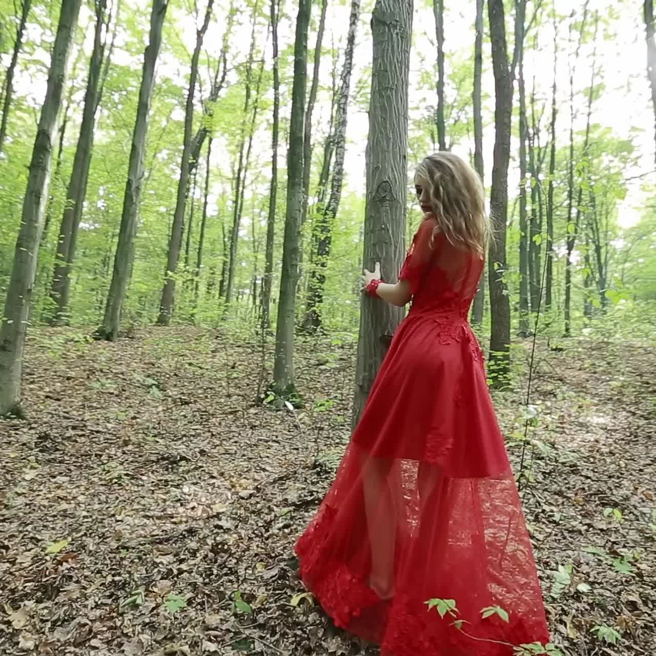 Beautiful Young Woman Walking On A Forest