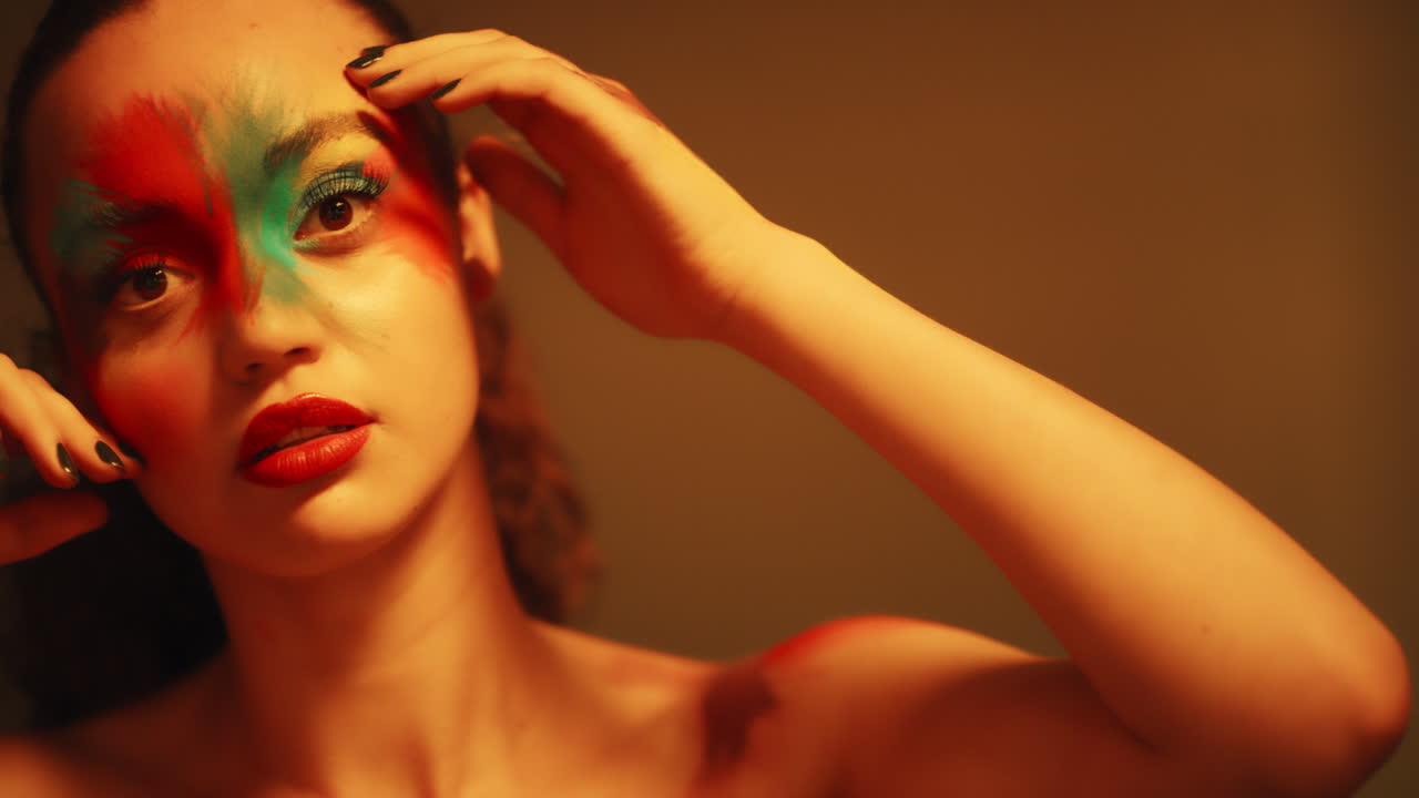 close up colorful portrait beautiful woman wearing fluorescent face paint exotic multicolored body art with flashing ultraviolet light extreme makeup concept