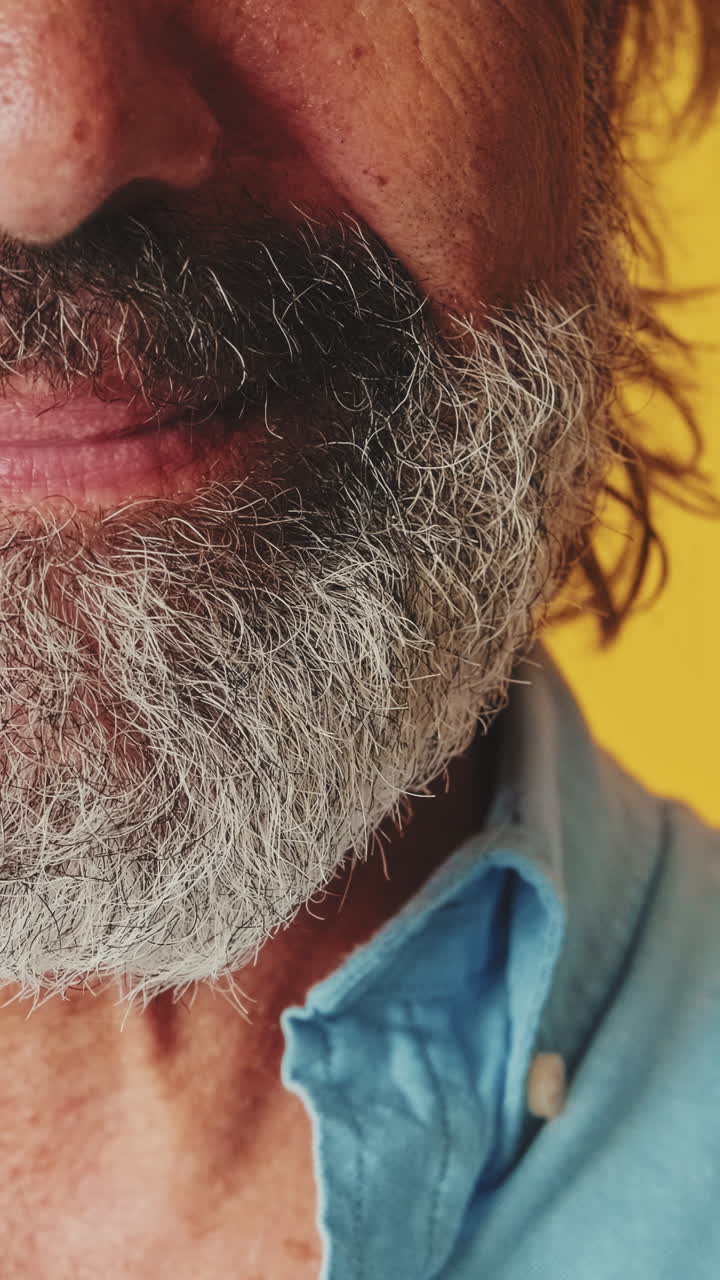 Close-up of a Smiling Man with a Grey Beard