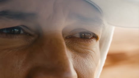 close-up of a person's face with squinting eyes