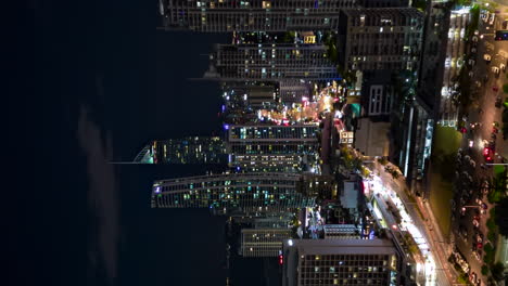 aerial night hyperlapse over downtown surfer's paradise, gold coast, australia, vertical format