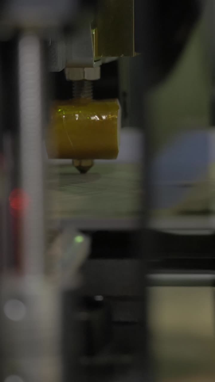 Close Up of 3D Printer Extruder Head Printing Object