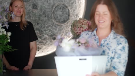 woman receiving a bouquet of flowers
