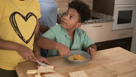 family preparing breakfast together in the kitchen