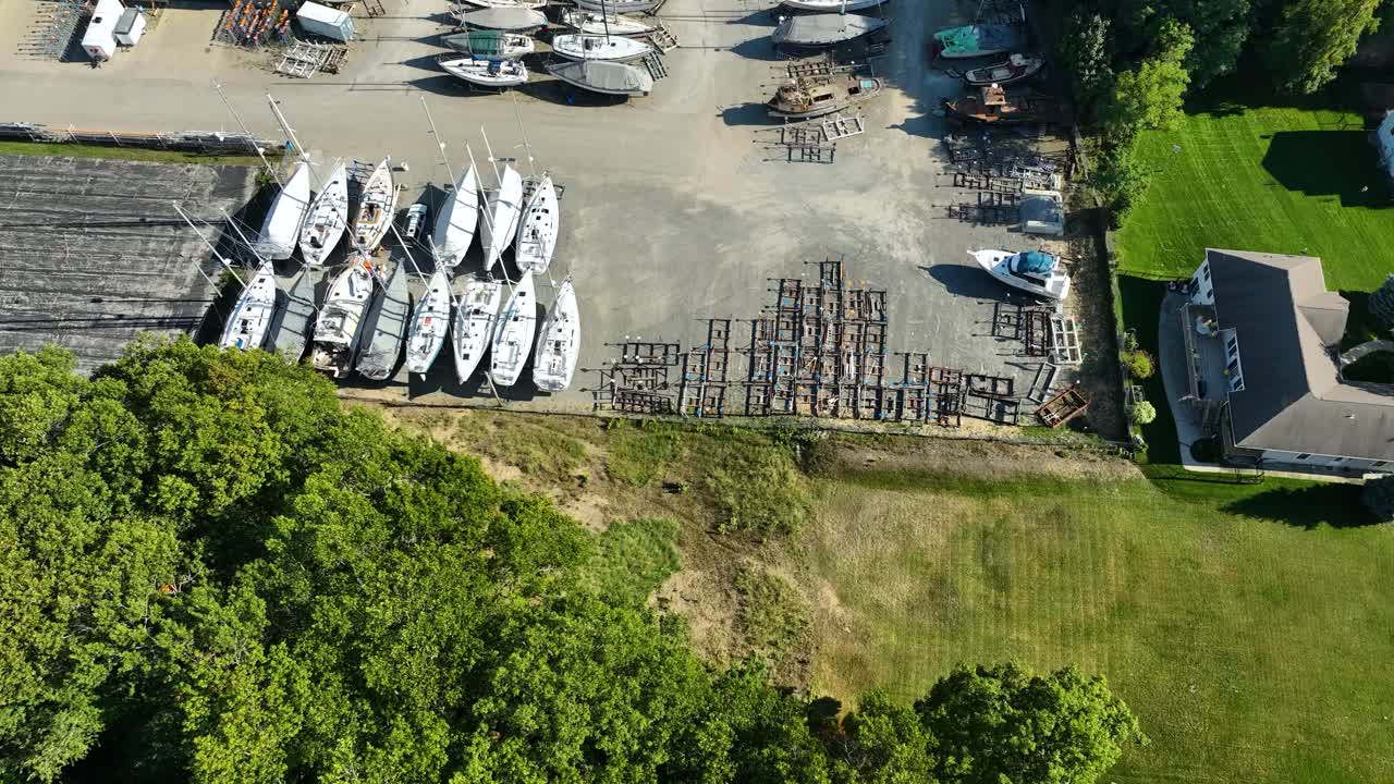 A local repair and salvage yard full of sailboats