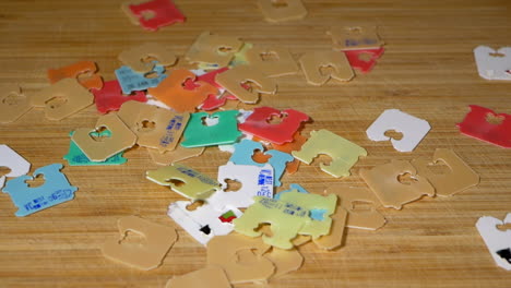 plastic bread tags fall down onto wooden board, slow motion