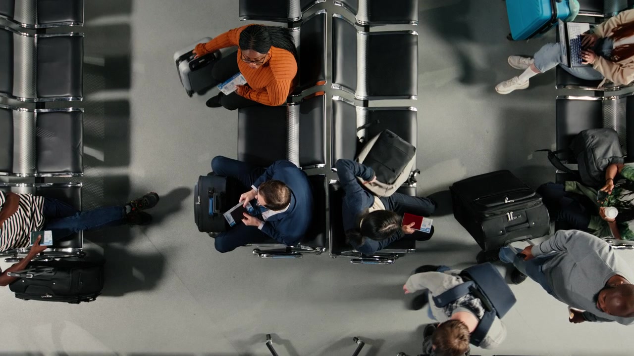 Preparing plane ticket, top down view and multiethnic passengers in airport