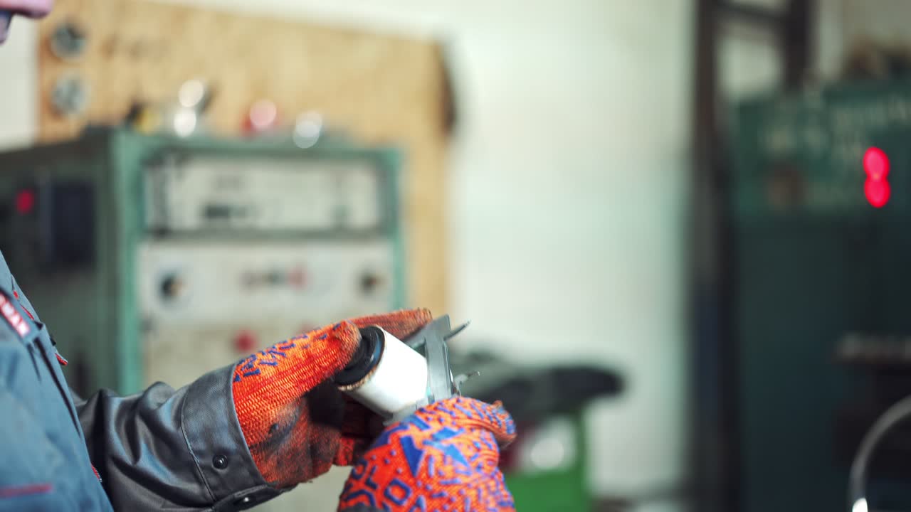 Technician measure part by vernier caliper. Close up of young male engineer taking precision measurement of metal parts with micrometer