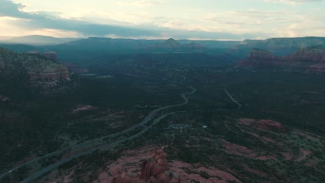 misty sunrise over sedona landscape with red rock formations in arizona, usa