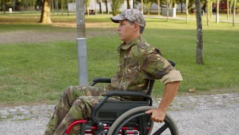 serious disabled military man in wheelchair