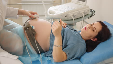 pregnant woman undergoing ultrasound examination