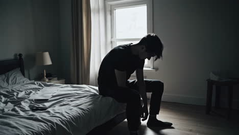 sad teenager in bedroom
