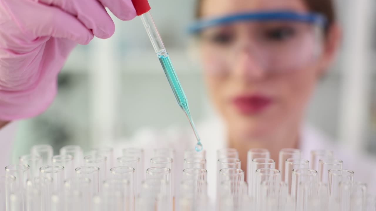 Scientist conducting experiments with test tubes in a laboratory