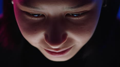 top view young asian woman using tablet computer working late browsing online looking at screen enjoying internet connection