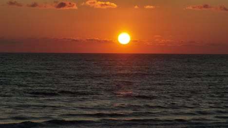 Sunset-of-mediterranean-sea-with-calm-waves-on-the-shore