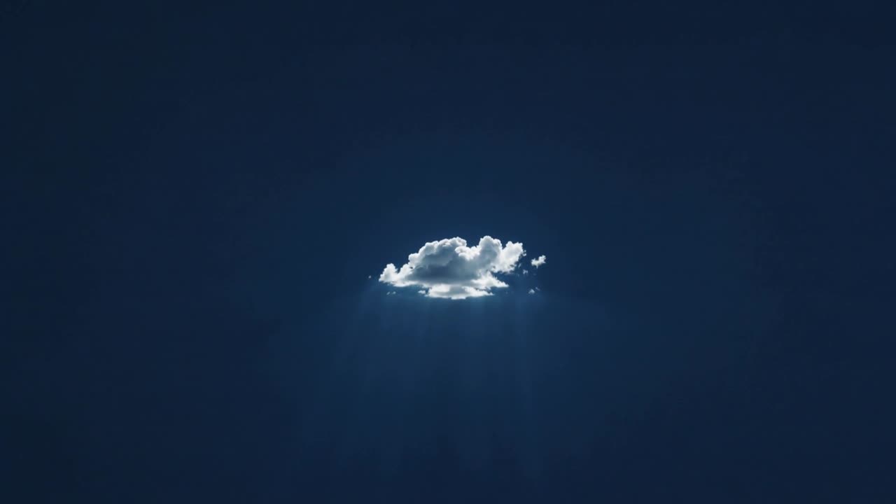 Shrinking single cumulus cloud heating from sun rays, fading and vanishing in deep-blue sky