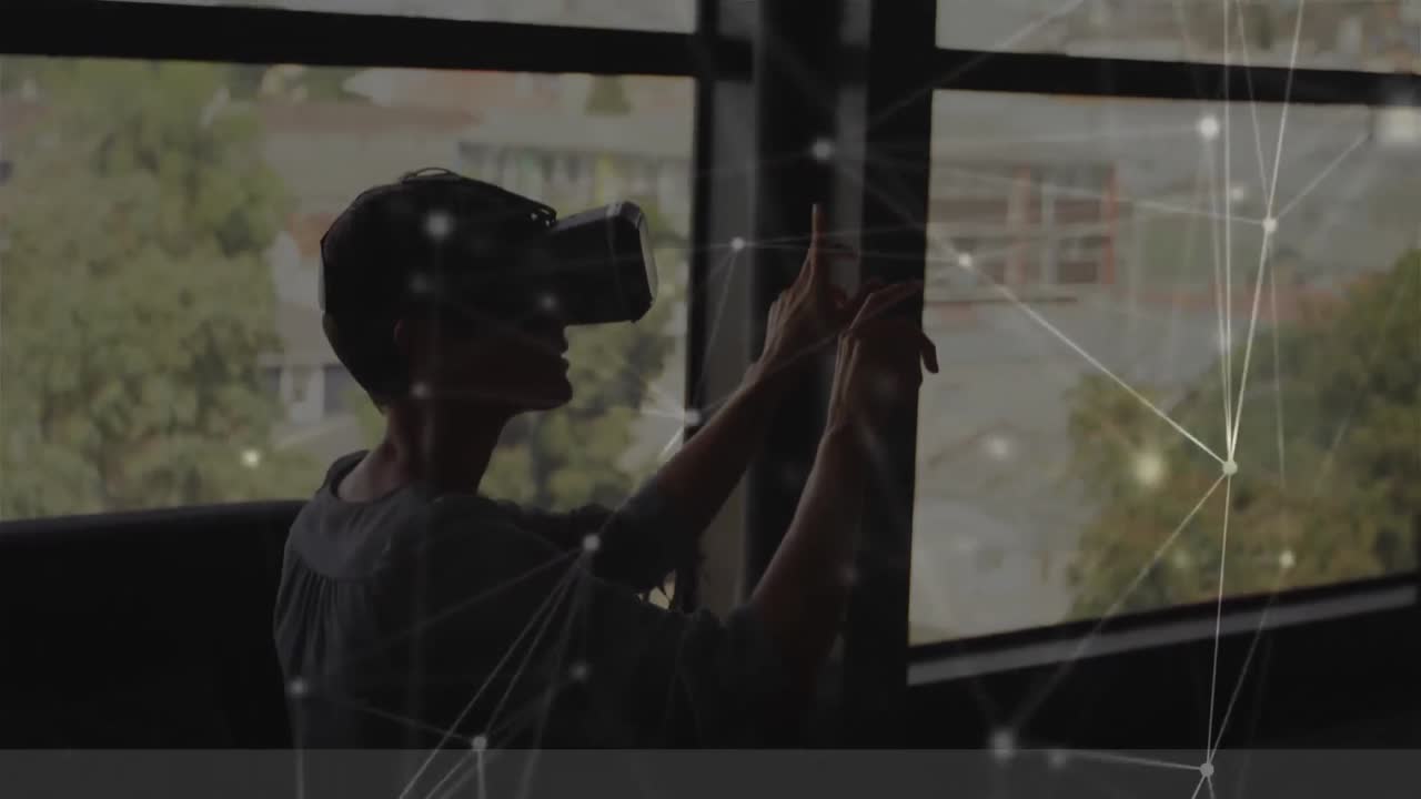 Woman swiping in the air while wearing a virtual reality headset
