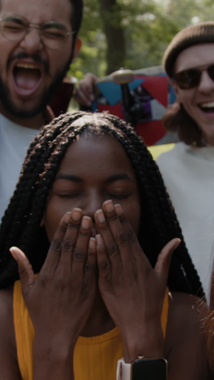Joyful Young Woman with Friends Outdoors