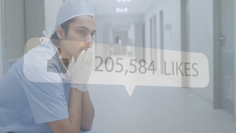 social media likes animation over thoughtful healthcare worker in hospital corridor