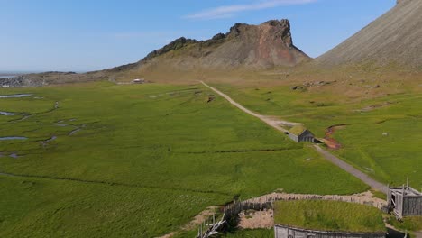 marvel at the striking contrasts of land and sea in the viking village, beautifully captured from above. this drone footage invites you to immerse yourself in icelandic heritage.