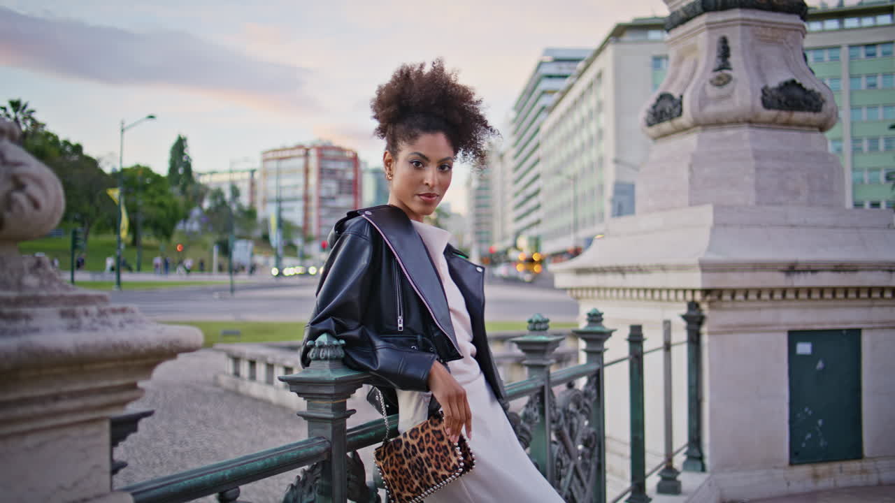 woman posing urban square by historical landmark closeup. Posh lady