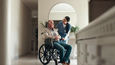 nurse assisting senior man in wheelchair