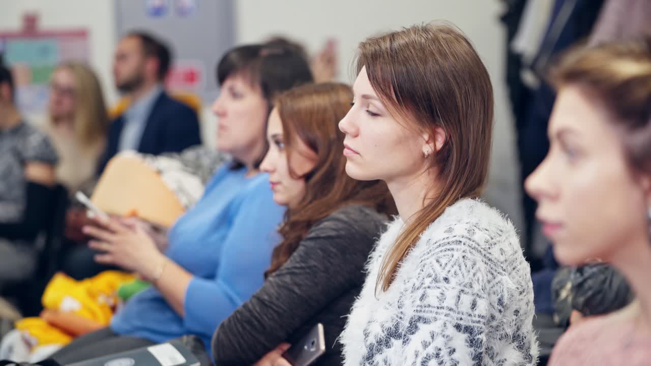 Business People Meeting Conference Seminar. Adult people listen to speaker providing lecture in conference hall