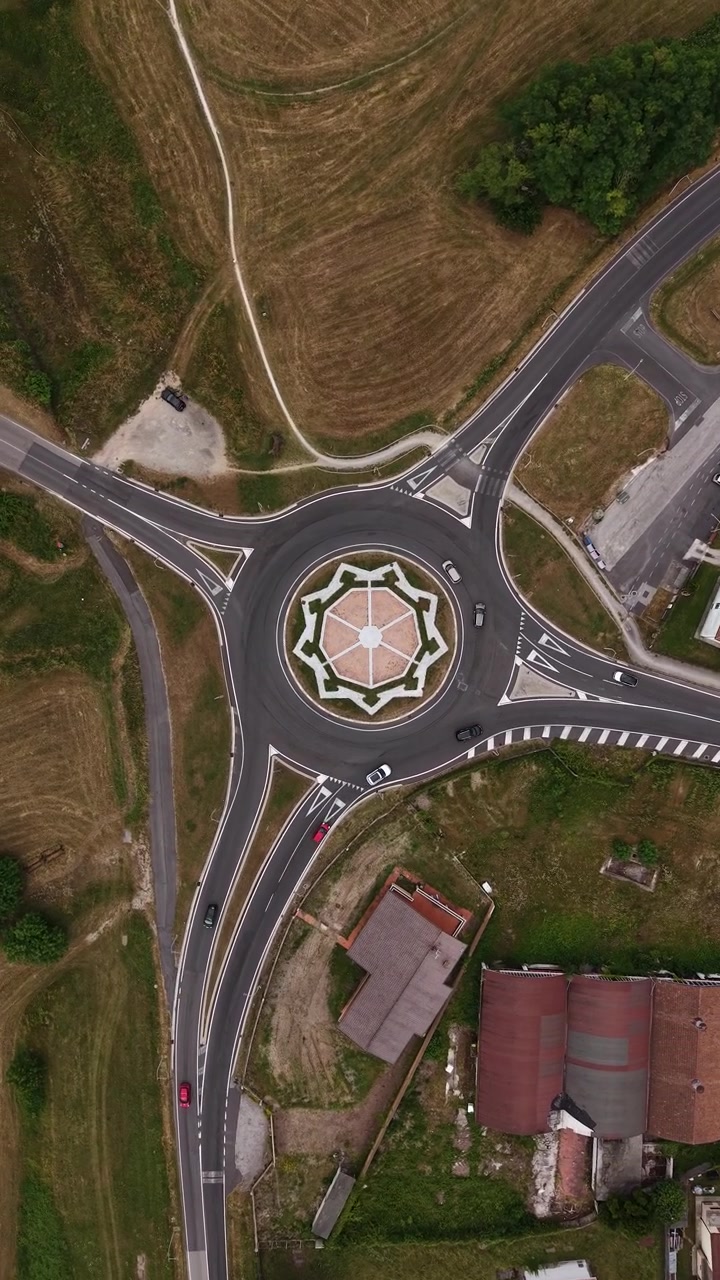Vertical Drone Shot of Roundabout Traffic Outside Palmanova, Italy, High Angle Aerial View