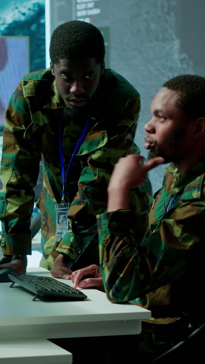 Vertical Video IT analyst managing satellite radar systems in modern control tower