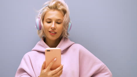 young woman with headphones and phone