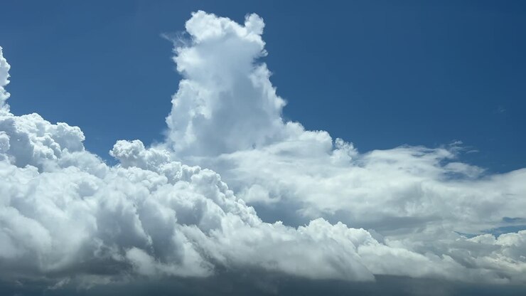 Flying troguh a cloudy sky with some tiny cumulus